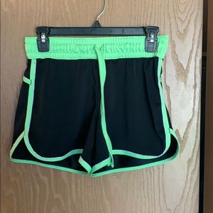 Black and neon green athletic shorts